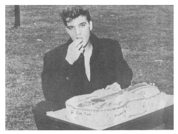 Presley, Elvis / Taking Bite of Guitar Shaped Cake / 1960