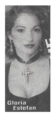 Estefan, Gloria / Closeup-Wearing Cross Necklace