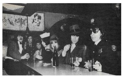 Rolling Stones, The / At the Bar, Bill Wyman at Right / 1970s