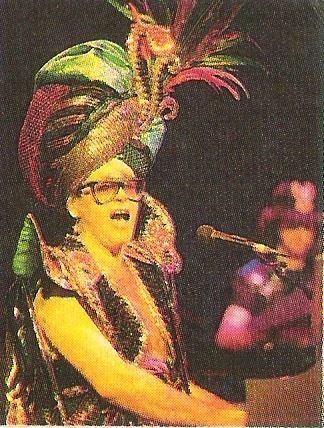 John, Elton / On Stage, Genie Costume. Black-Rimmed Glasses / 1986