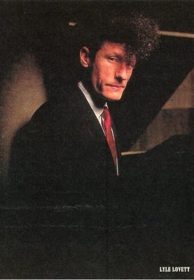 Lovett, Lyle / Lyle in Black Suit, White Shirt, Red Tie / 1988