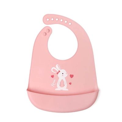Babador de silicone rosa kiokids com estampa de coelhinho, ideal para a hora da papinha.