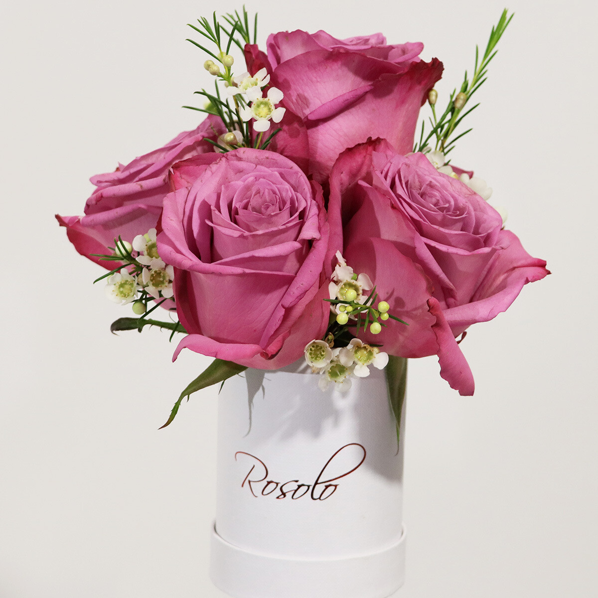 Jolie petite boite de roses mauves