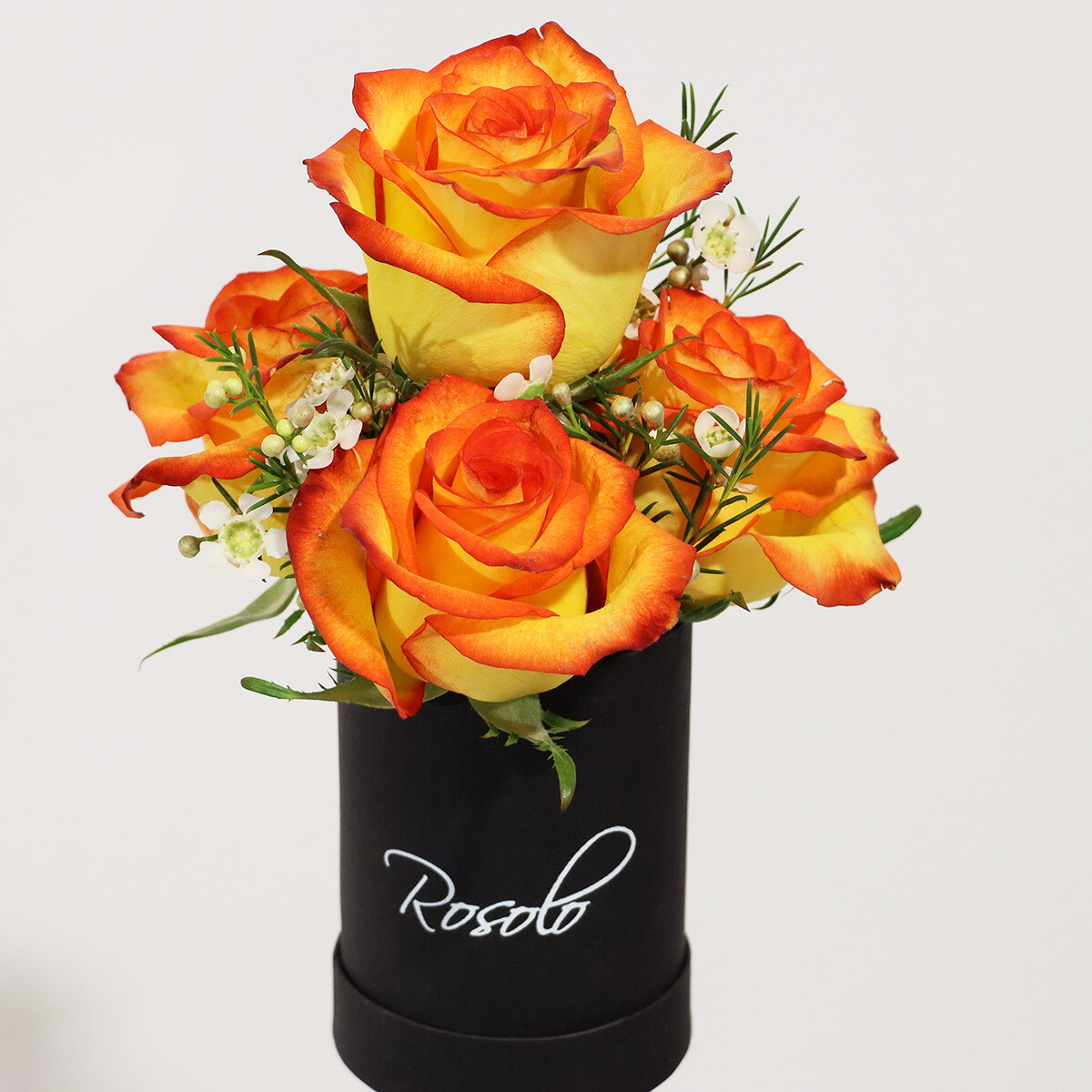 Jolie petite boite de roses jaunes