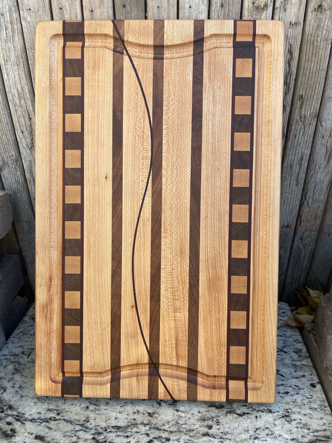 Stylish handcrafted wooden cutting board from Manta Wood Creations

