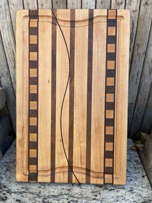 Stylish handcrafted wooden cutting board from Manta Wood Creations

