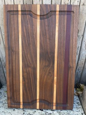 Elegant handcrafted wooden cutting board from Manta Wood Creations


