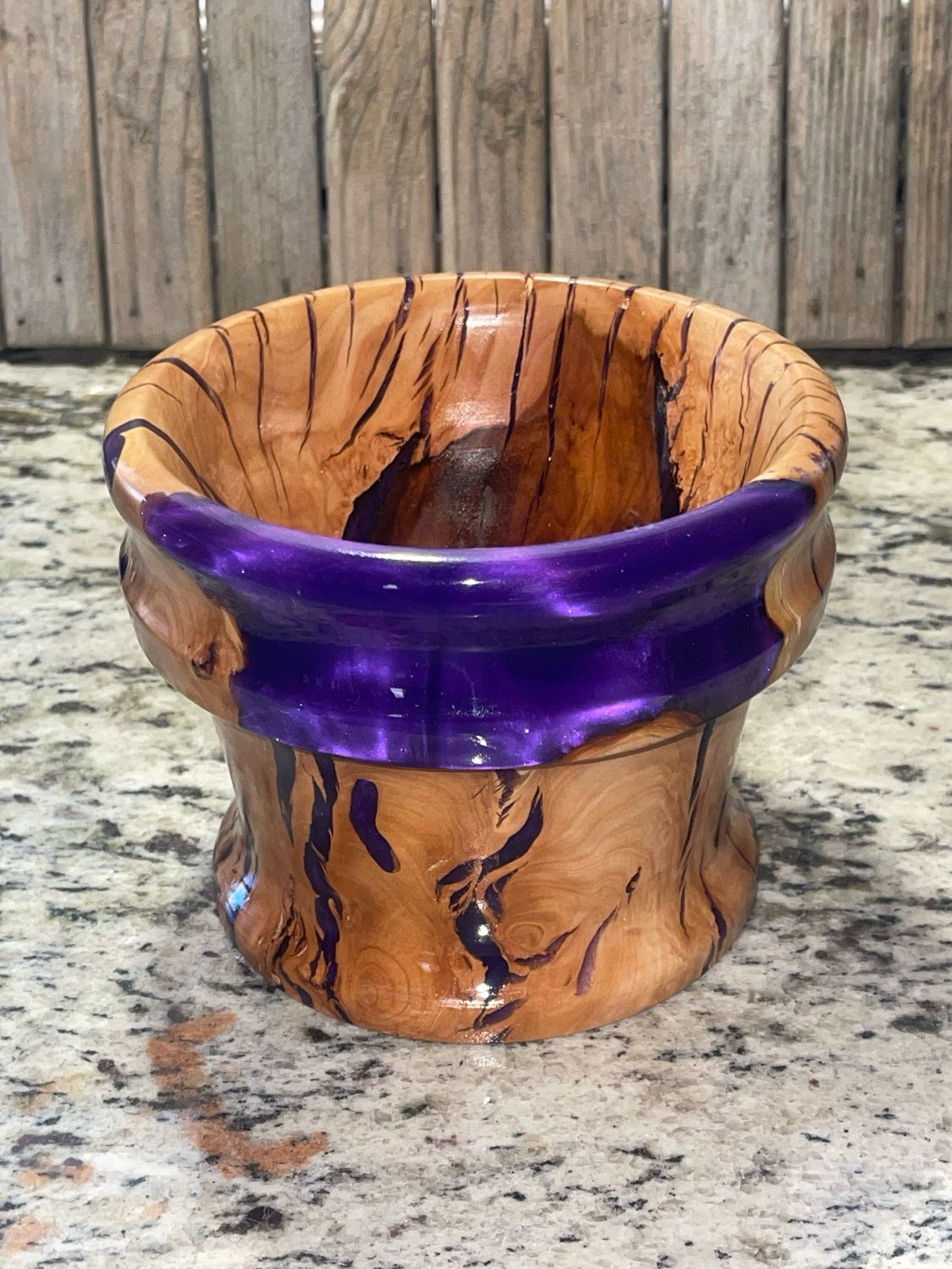 Beautiful natural grain patterns and cracks highlighted with purple epoxy resin on this fine vase