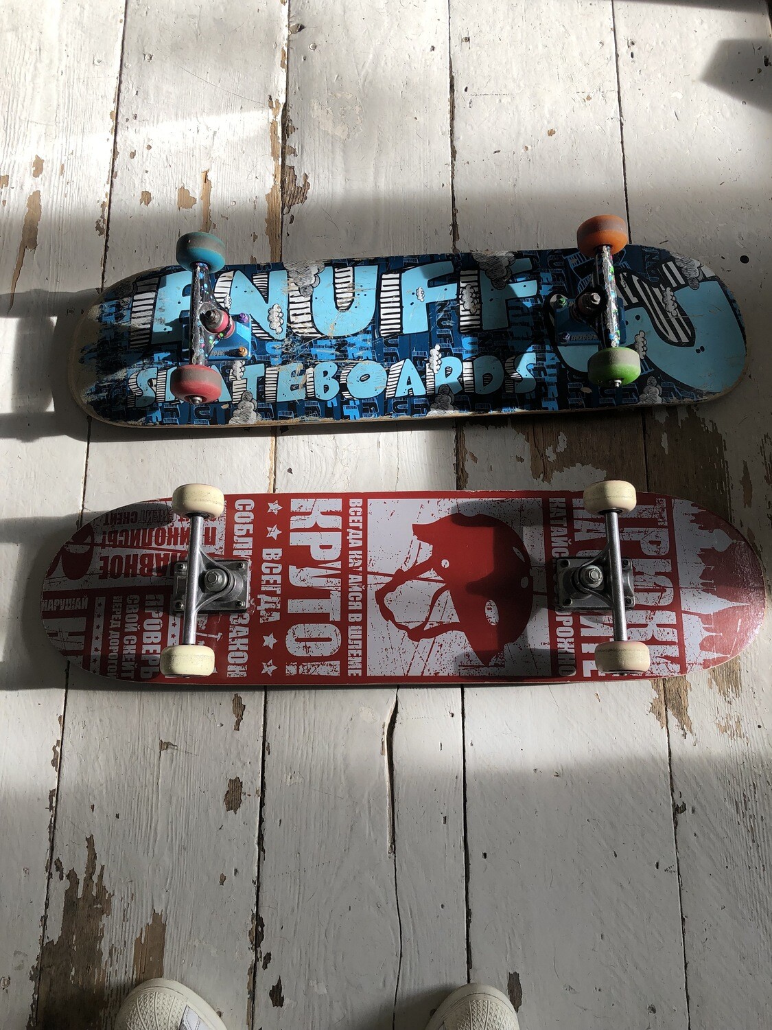 a pair of rare vintage skateboards