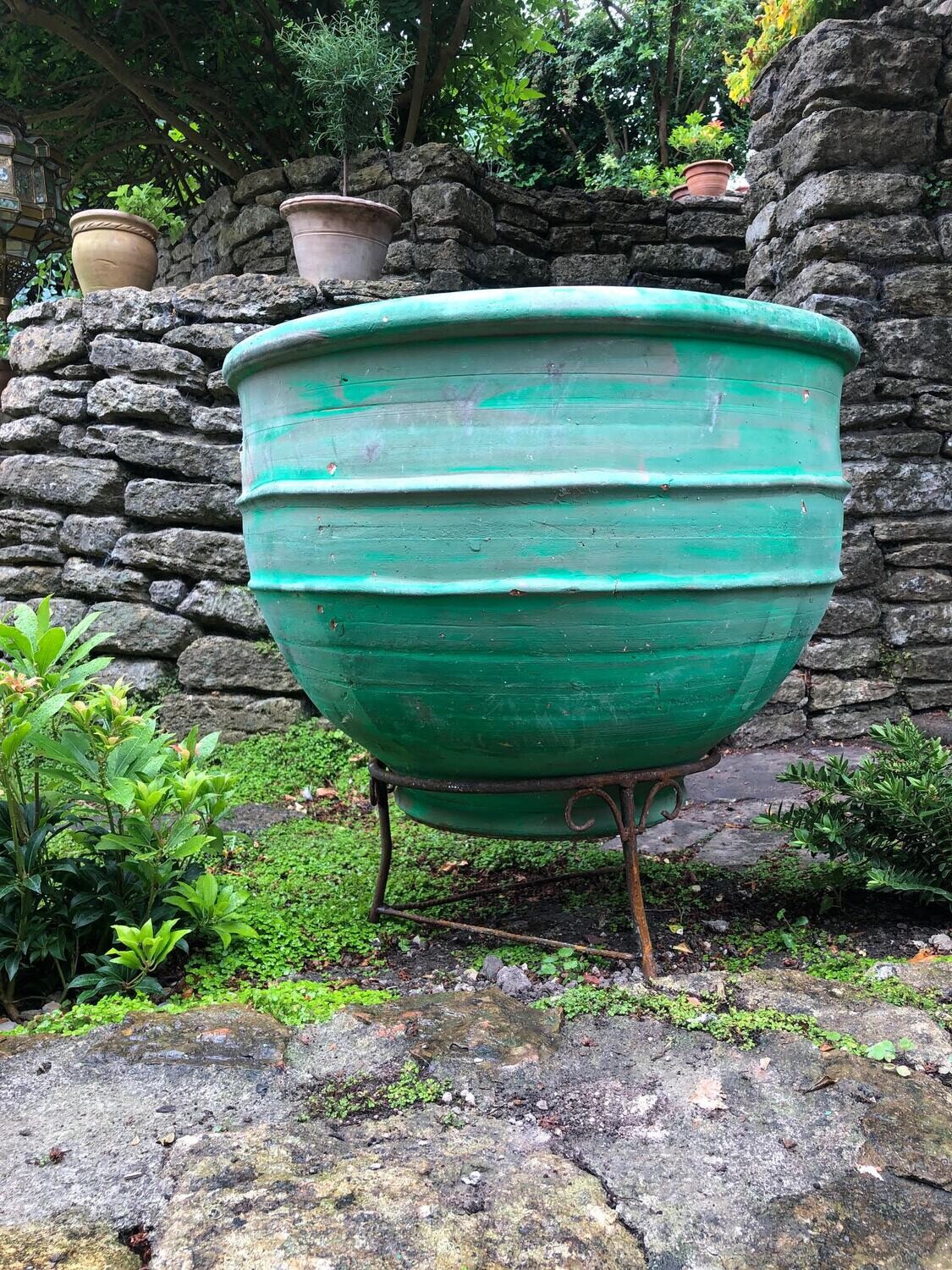 Large Moroccan planters on iron stands