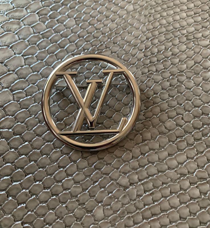 Lv brooch