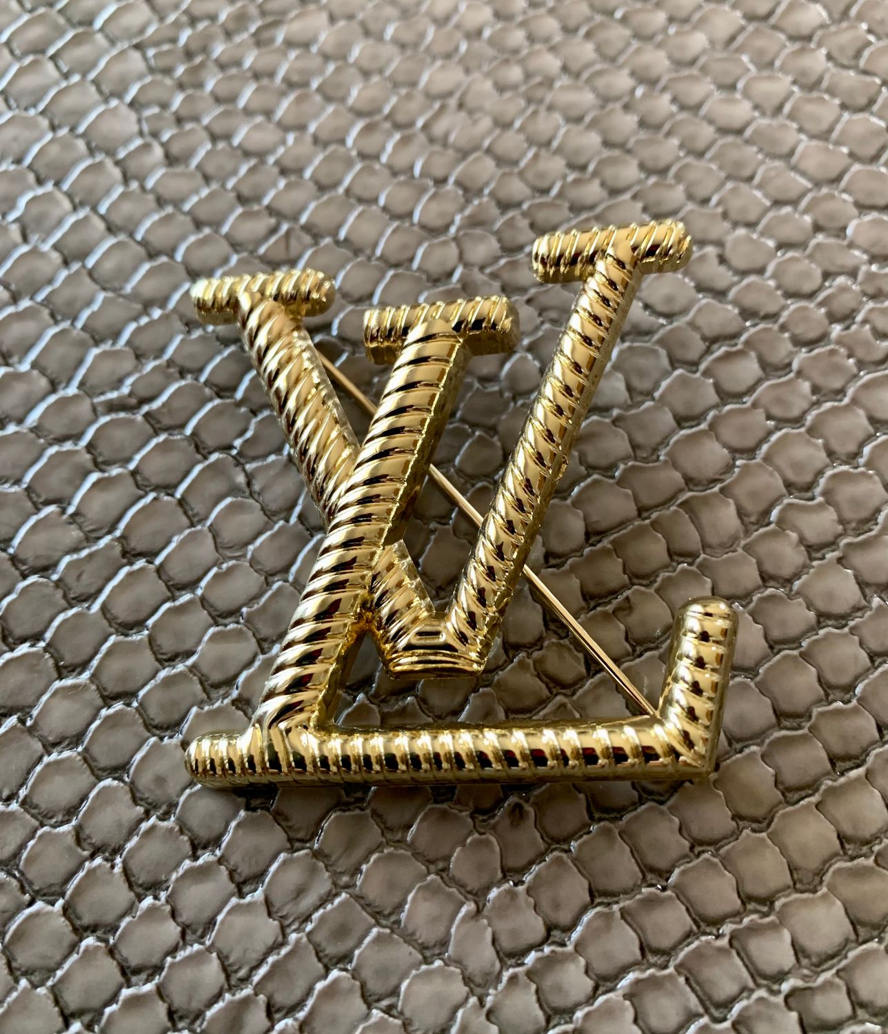 Lv brooch