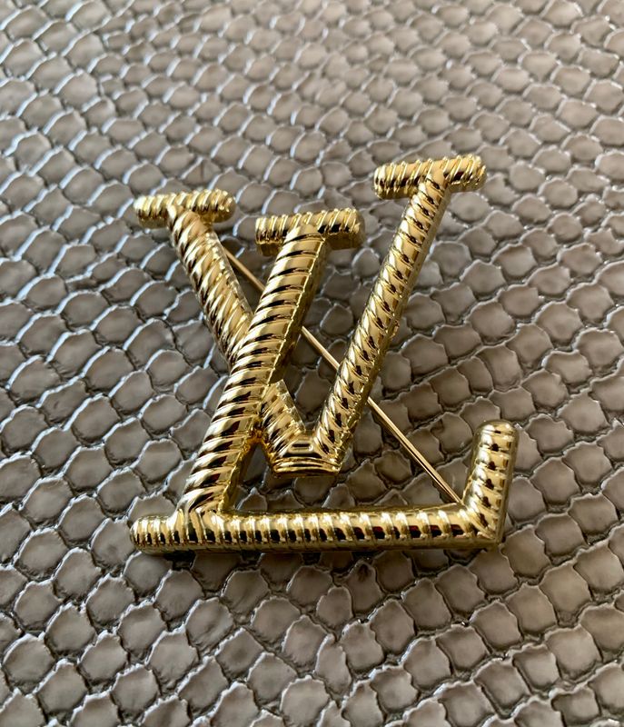 Lv brooch