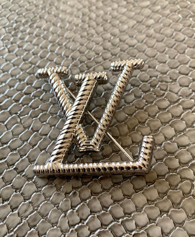 Lv brooch