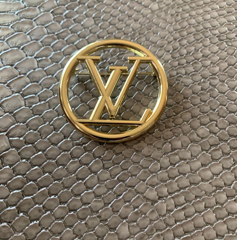 Lv brooches