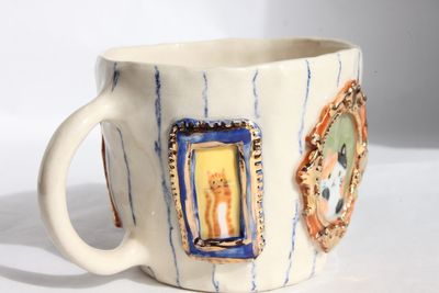 Cat Picture Frames Mug with stripey wallpaper