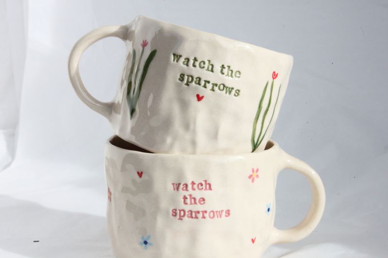 'watch the sparrows' mugs
