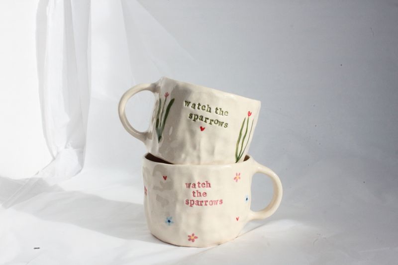 'watch the sparrows' mugs
