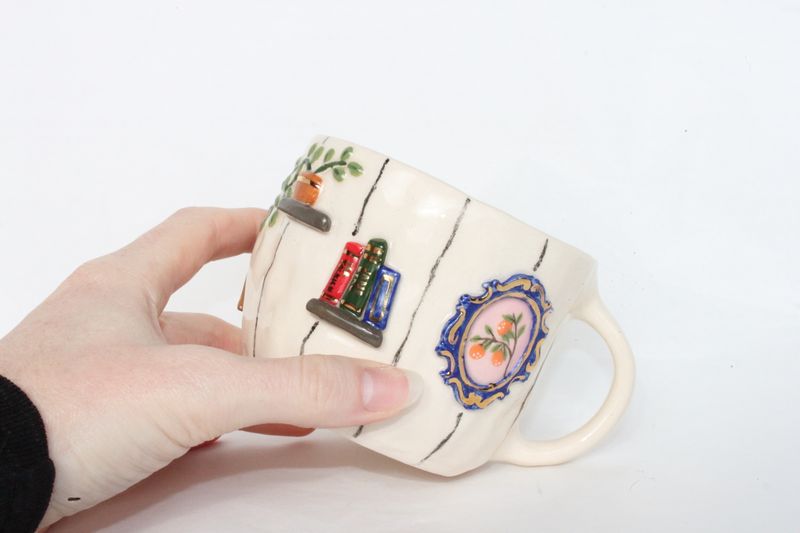Gallery Mug - plant and bookshelves