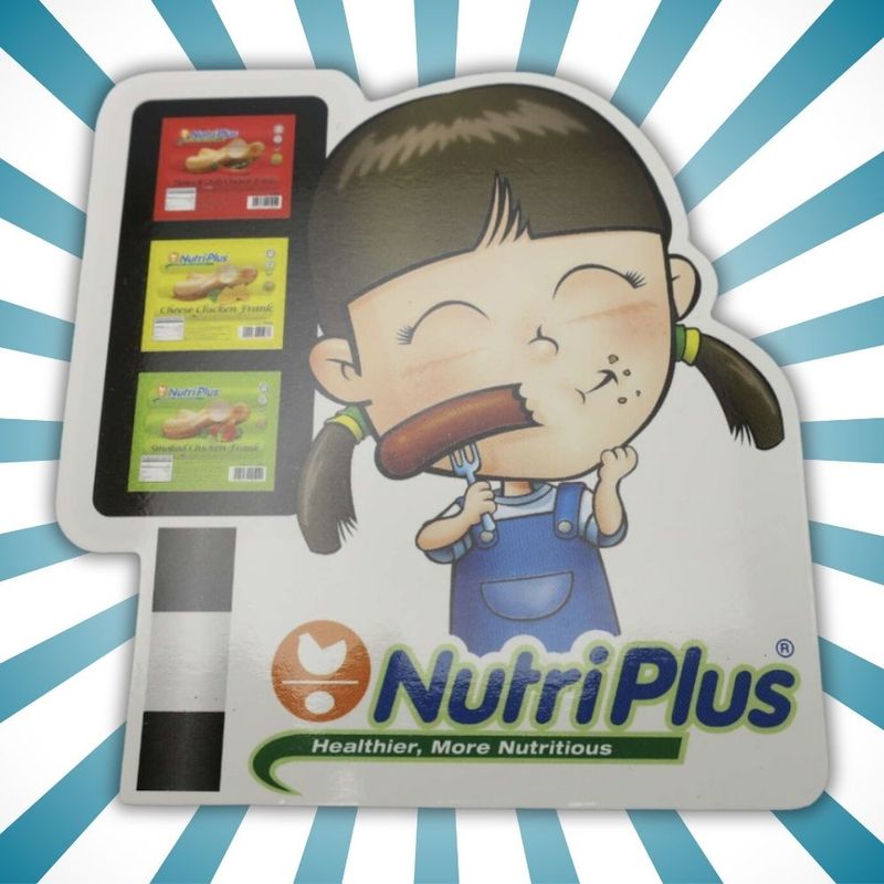NutriPlus fridge magnet featuring a cartoon girl eating a frankfurter next to illustrations of product packages.