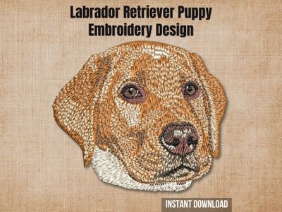 Labrador retriever puppy digital embroidery design mockup over a textured tan fabric background.