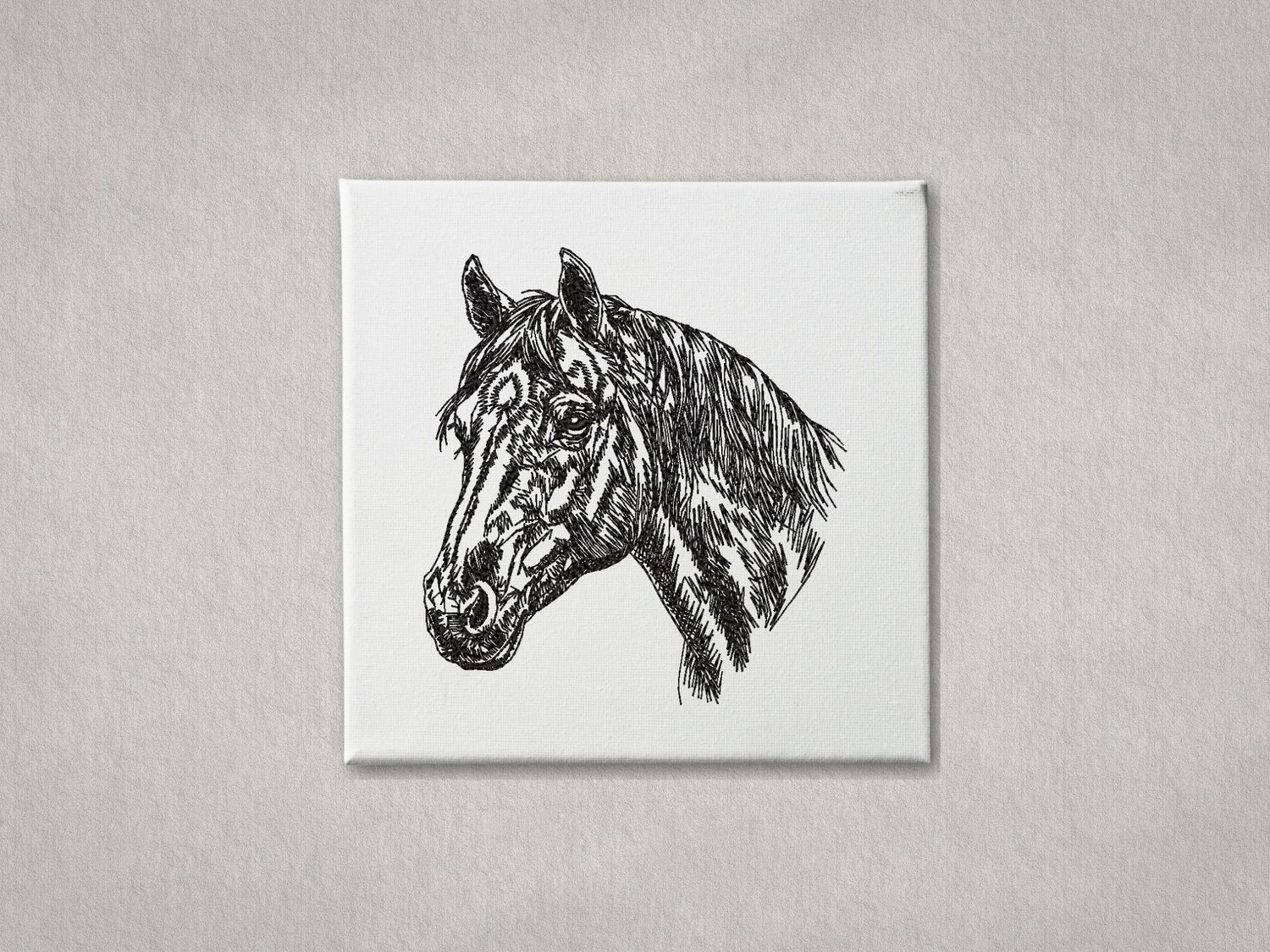 Detailed black embroidered horse head portrait on white gallery-wrapped canvas. Minimalist grey textured wall background.