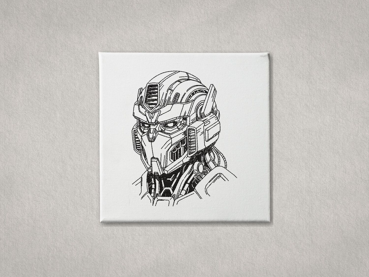 Detailed black embroidered robot head on white gallery-wrapped canvas. Minimalist grey textured background.
