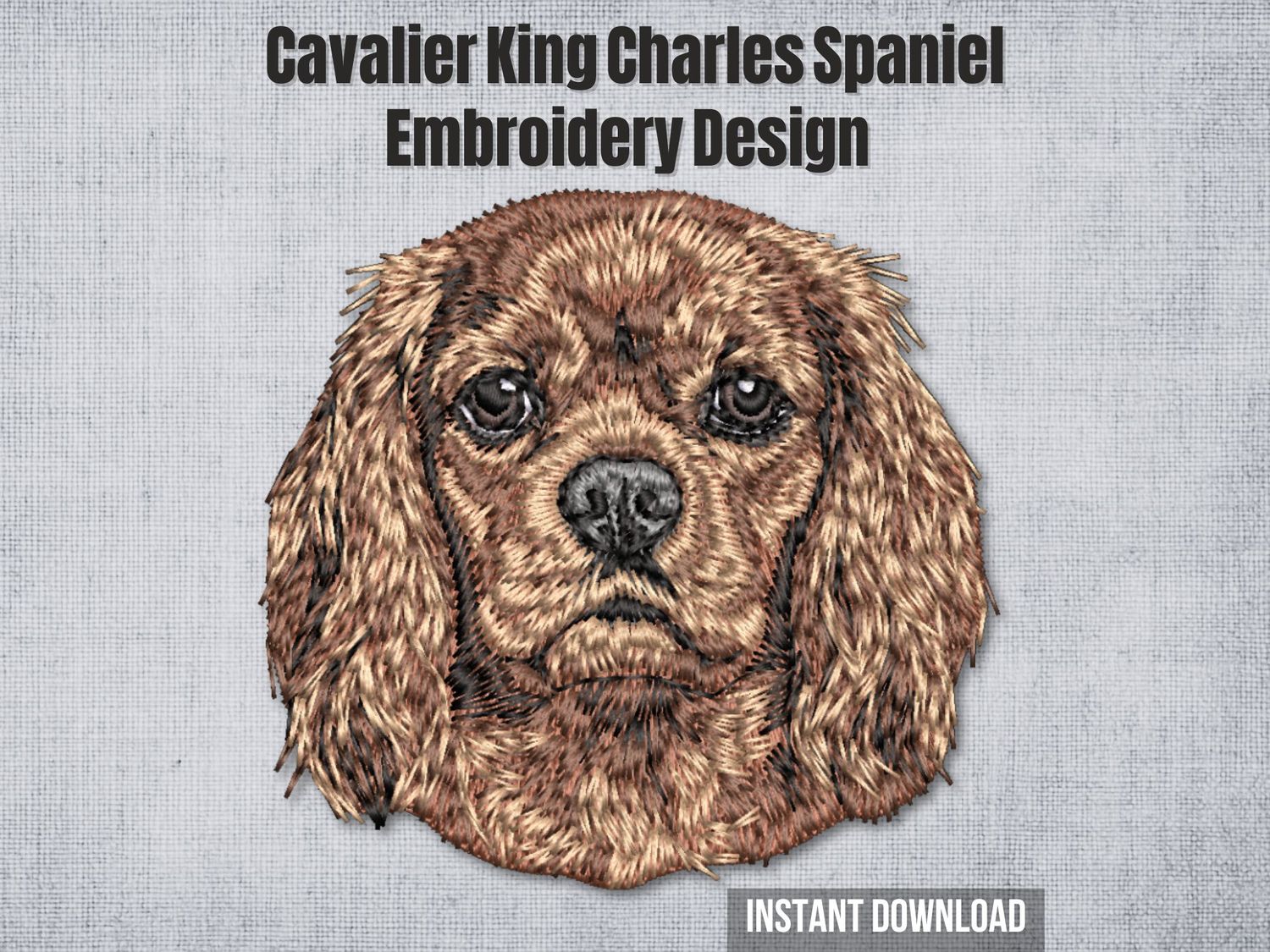 Detailed embroidery of a Ruby Cavalier King Charles Spaniel with chestnut fur, stitched on light fabric background.