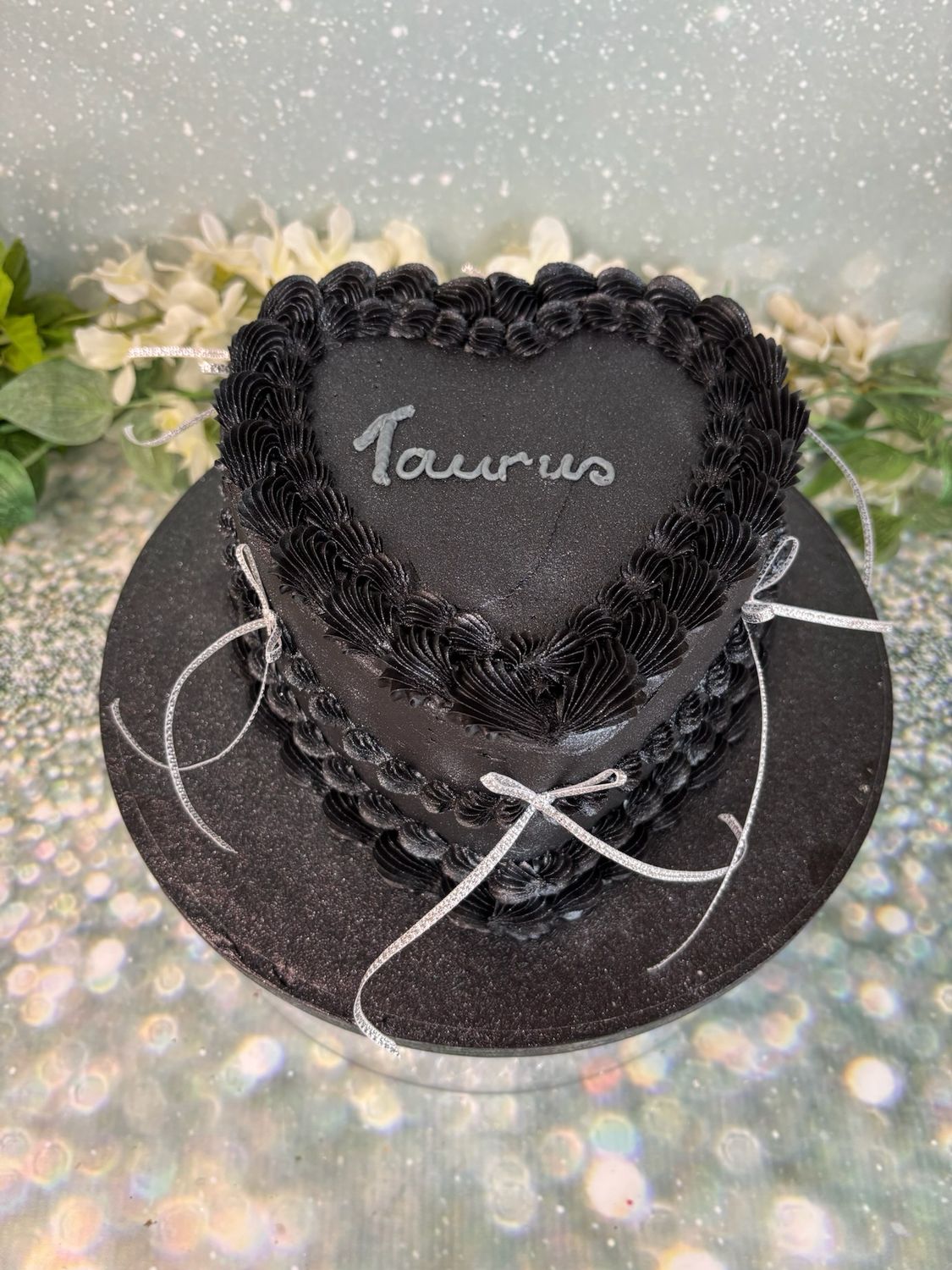 Black Heart Shaped Cake With Shimmer And Silver Bows
