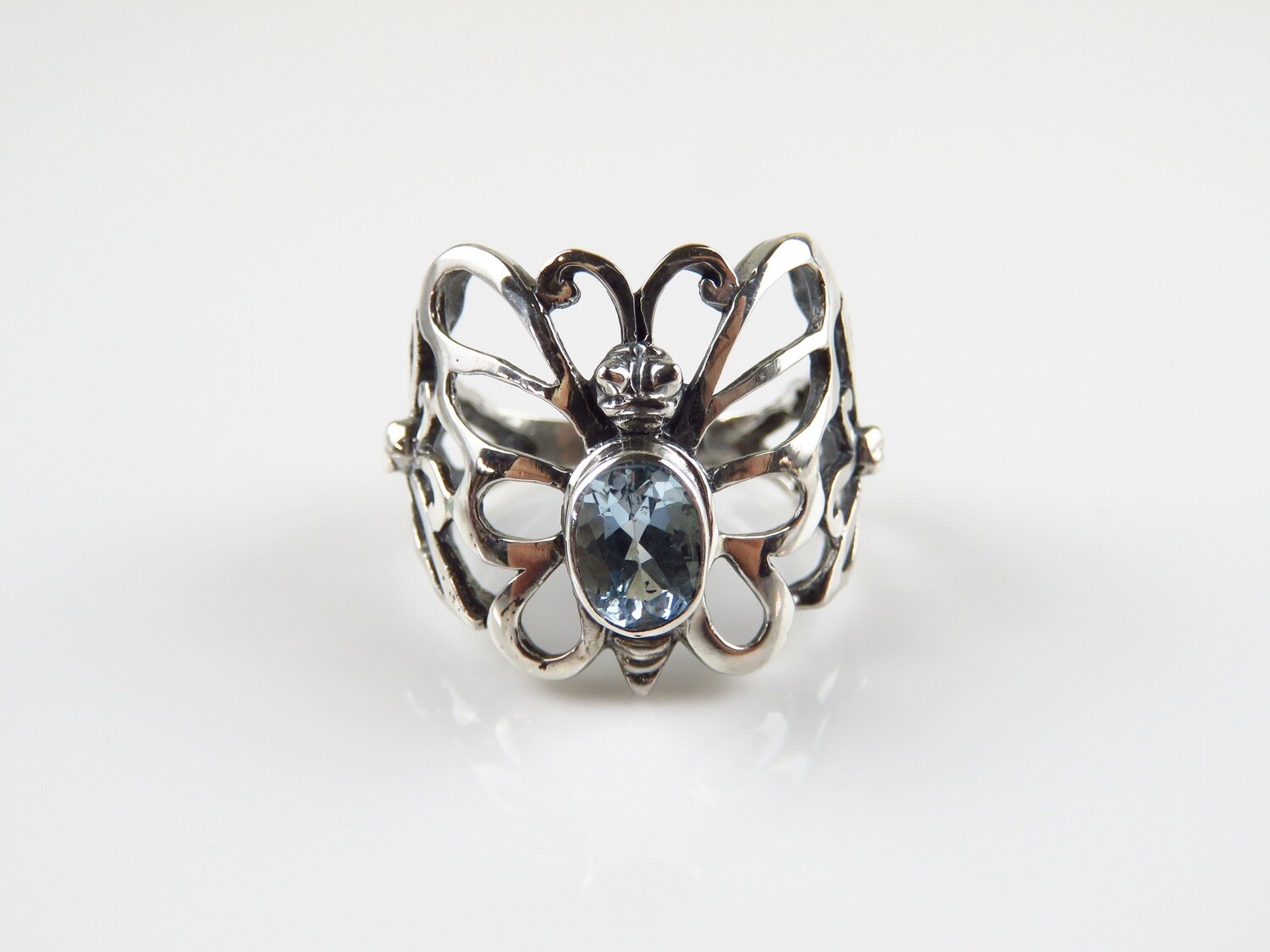 Sterling silver blue topaz butterfly design gemstone ring.