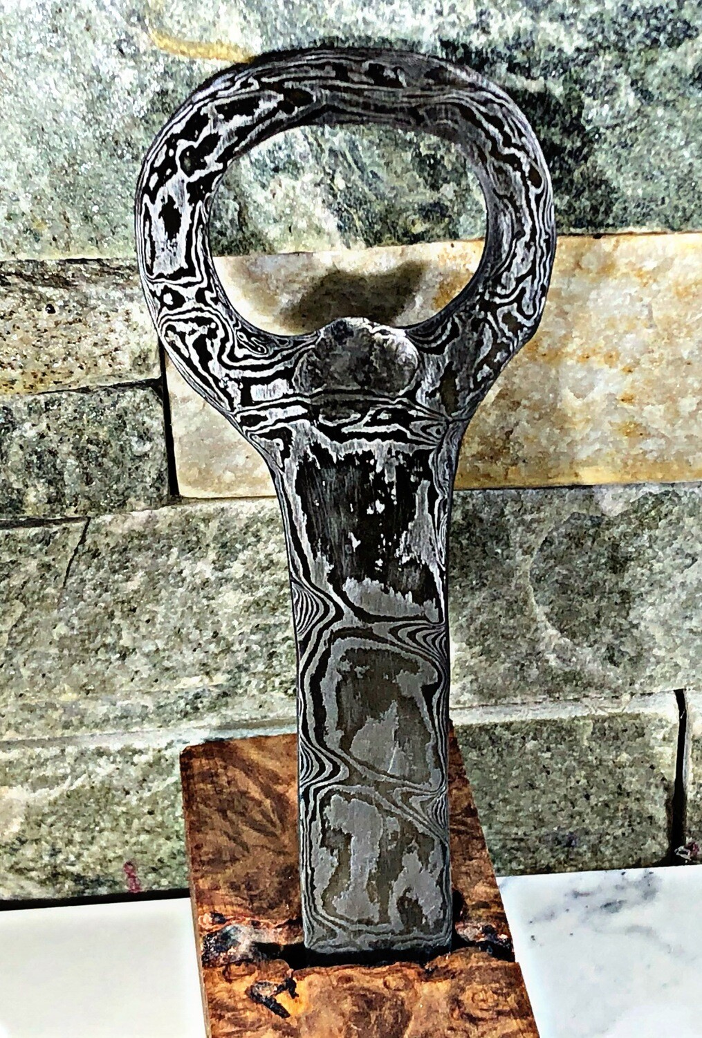 Damascus bottle opener- 65 layers hand forged