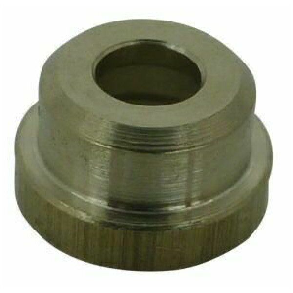 Round brass metal bush with central cavity for a screw on a white background 
