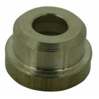 Round brass metal bush with central cavity for a screw on a white background 