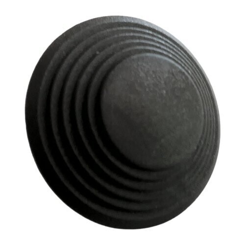 Round Black molded plastic part with six stepped equal tiers the top tier being about half the diameter of the base  