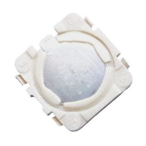 White squarish surface mount device with dome top switch surface on a white background
