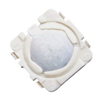 White squarish surface mount device with dome top switch surface on a white background