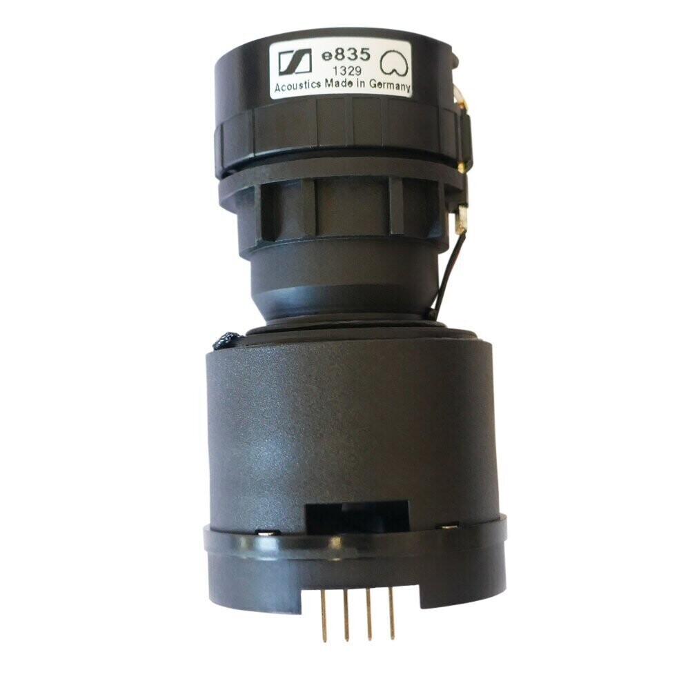 Black Sennheiser mic capsule encased in a housing labelled e835 with four contact pins for XSW microphone on white background