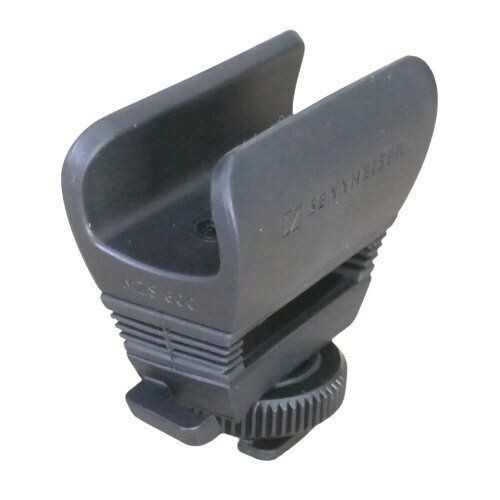 Black molded mic clamp sat on camera flash hot shoe mount with Sennhieser logo and MZS600 on a white background