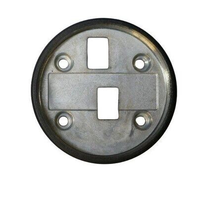 Circular coated metal plate with black outer surface and with four round holes and two rectangular holes in central section