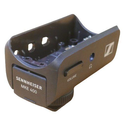 Sennheiser empty Cradle shaped battery tray module with cut-outs and printed Sennhieser MKE 400 on a white background