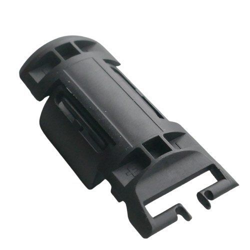 Black molded symmetrical battery flap component with two appendages shaped like beetles antennae on a white background   