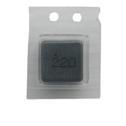 Black SMD Inductor component in a plastic dispensing track compartment with the value 220 printed in bold on cover