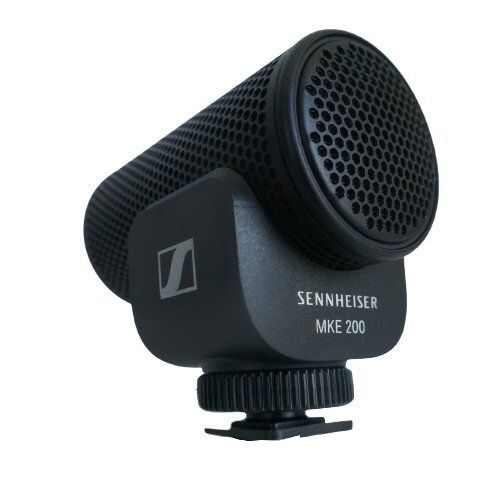 Sennheiser black MKE200 mic with grill holes in a cyclindrical body with a camera shoe mounting plate on a white background