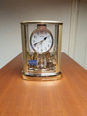 Rythm Mantel Clock with rotating pendulum