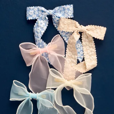 The Darling Effect Sheer Bow