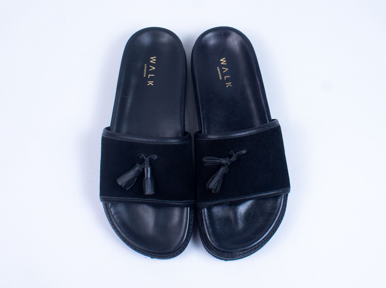 WALK LONDON RONNY TASSEL SLIDER SANDALS IN BLACK SEUDE