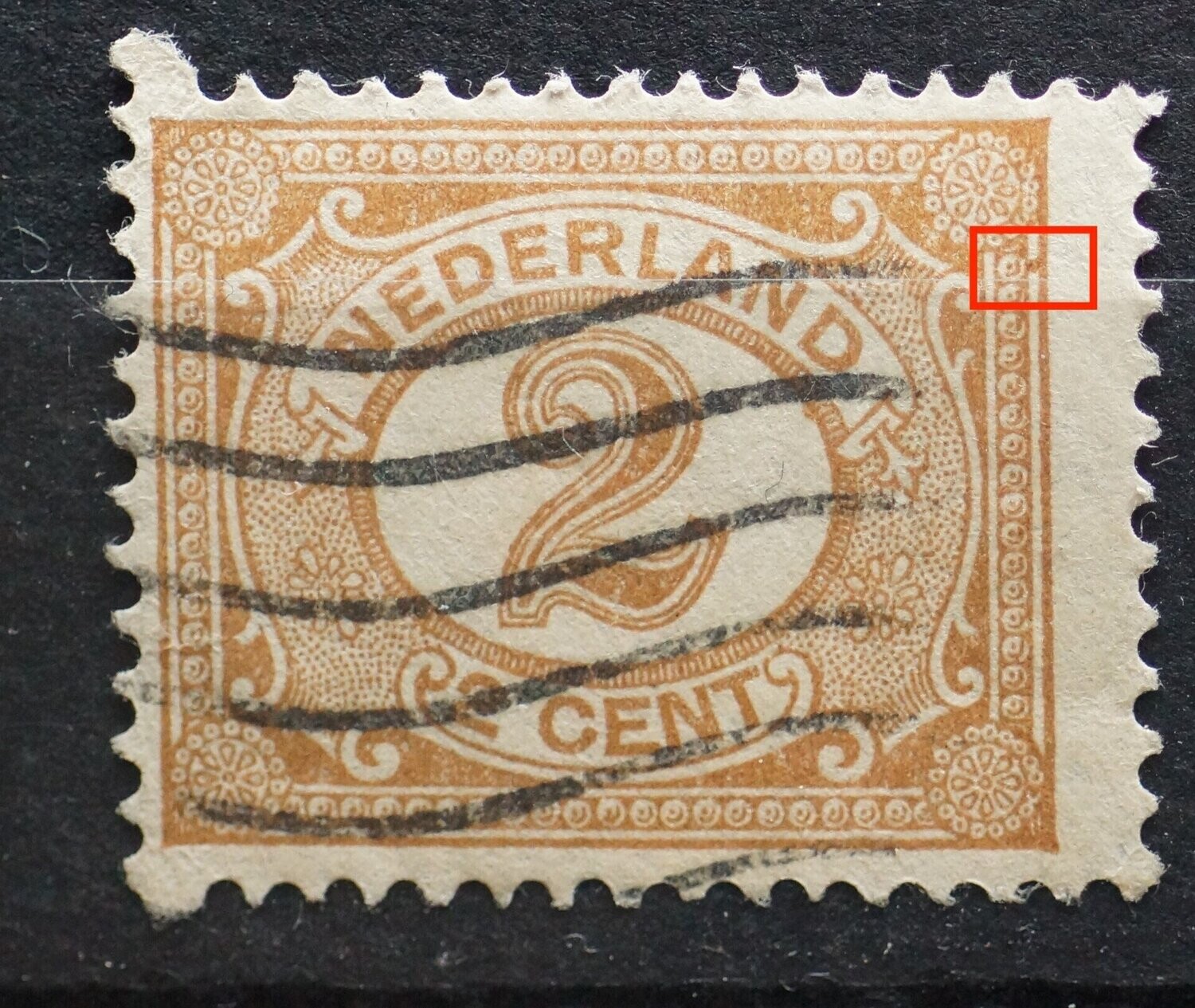 NVPH 54 - bruine vlek tussen kaderlijnen rechts