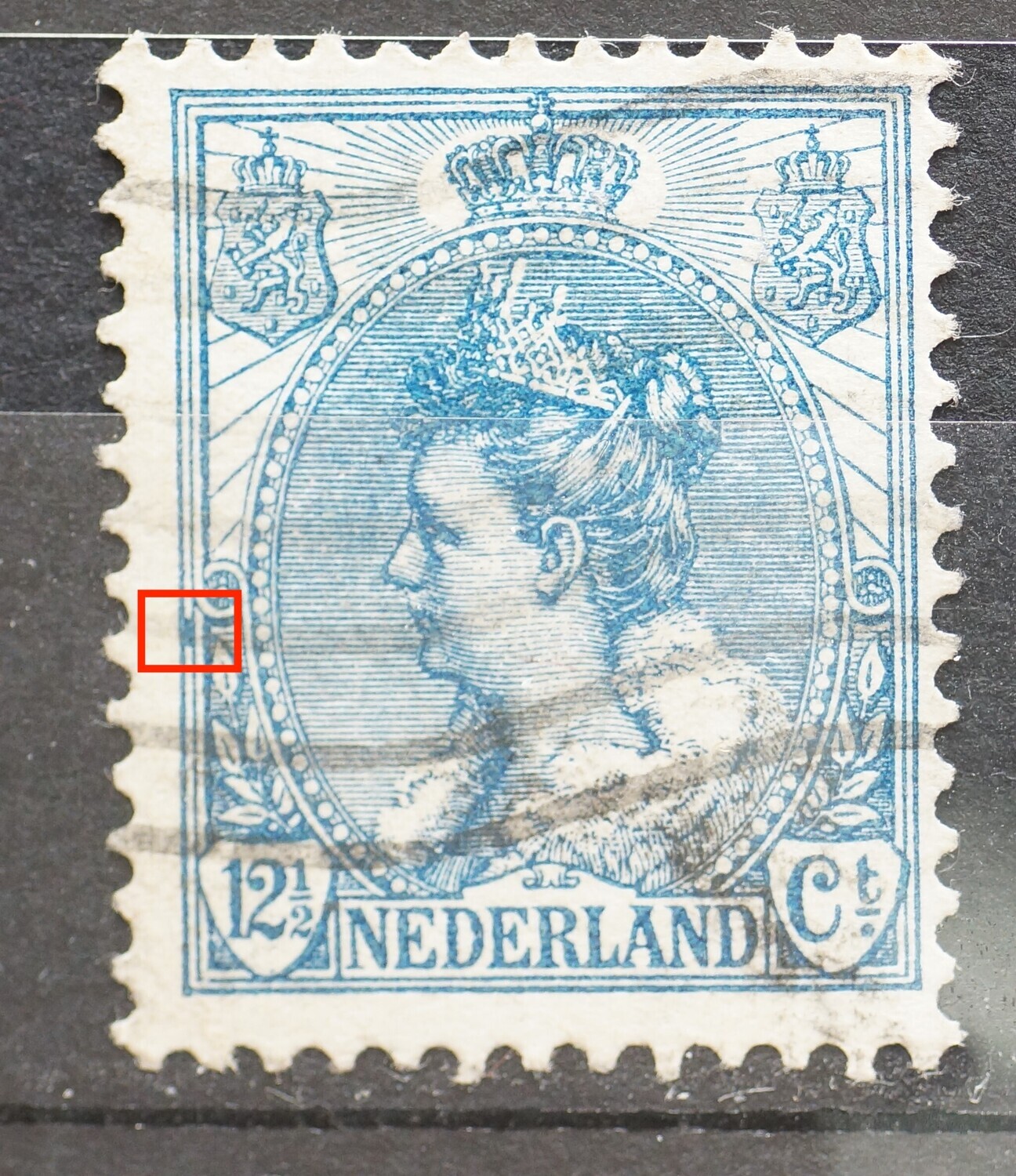 NVPH 63 - blauwe vlek tussen kaderlijnen links