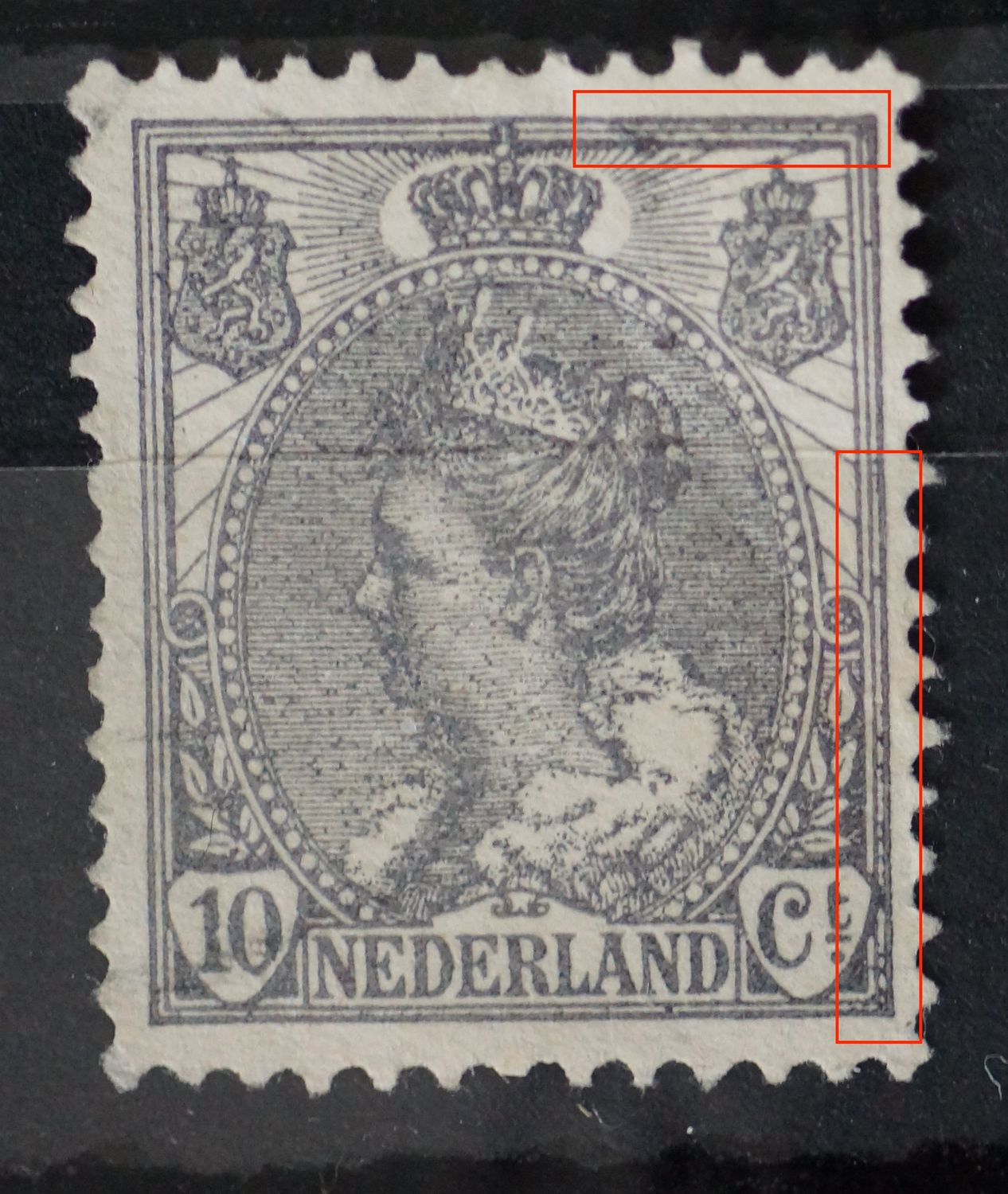 NVPH 62 - grijze vlekken tussen kaderlijnen en in de arcering ("regen")