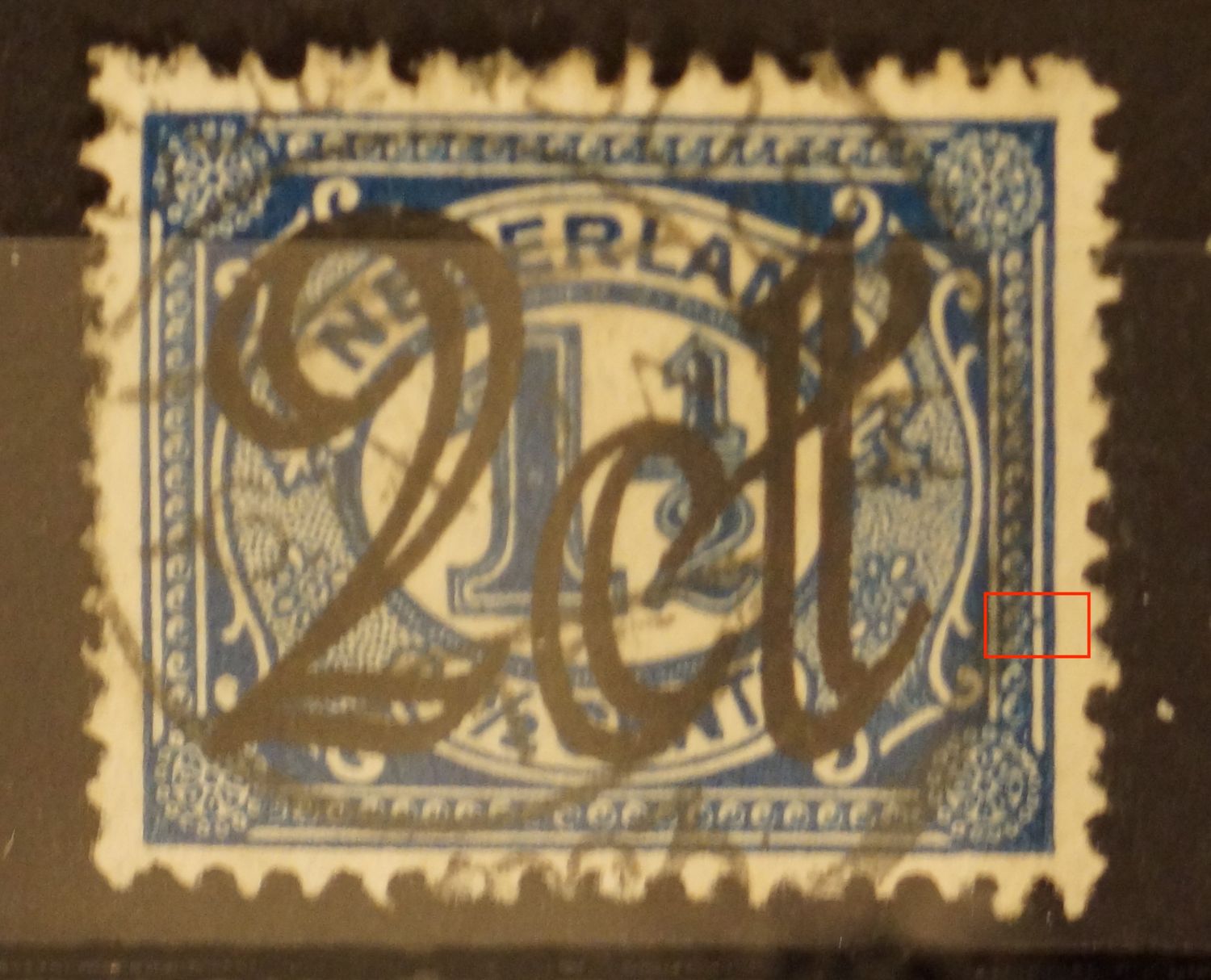NVPH 115 - blauwe vlek tussen kaderlijnen rechts
